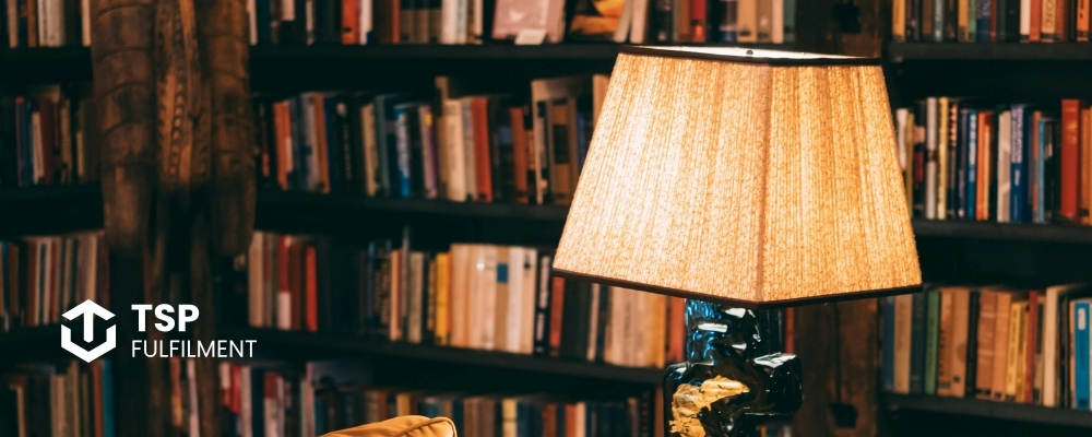 A room with shelves, filled with books.